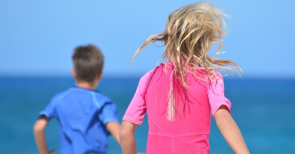 Children at the beach (public domain photo)